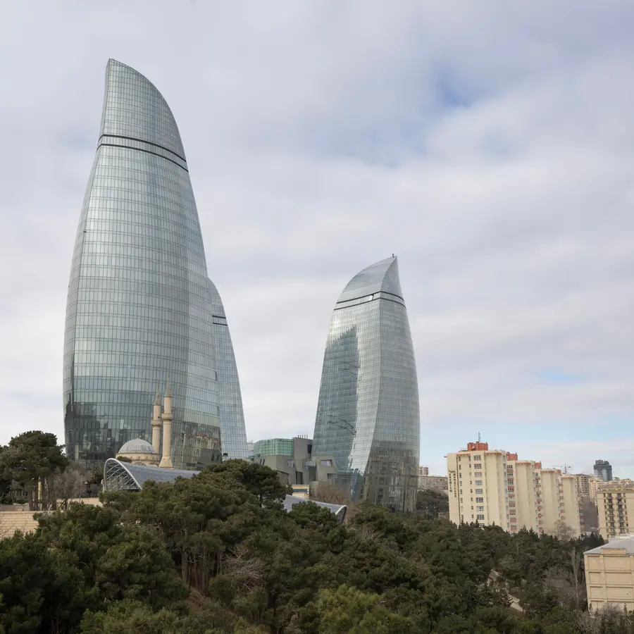 Stunning view of Baku's Flame Towers with surrounding urban park and cityscape