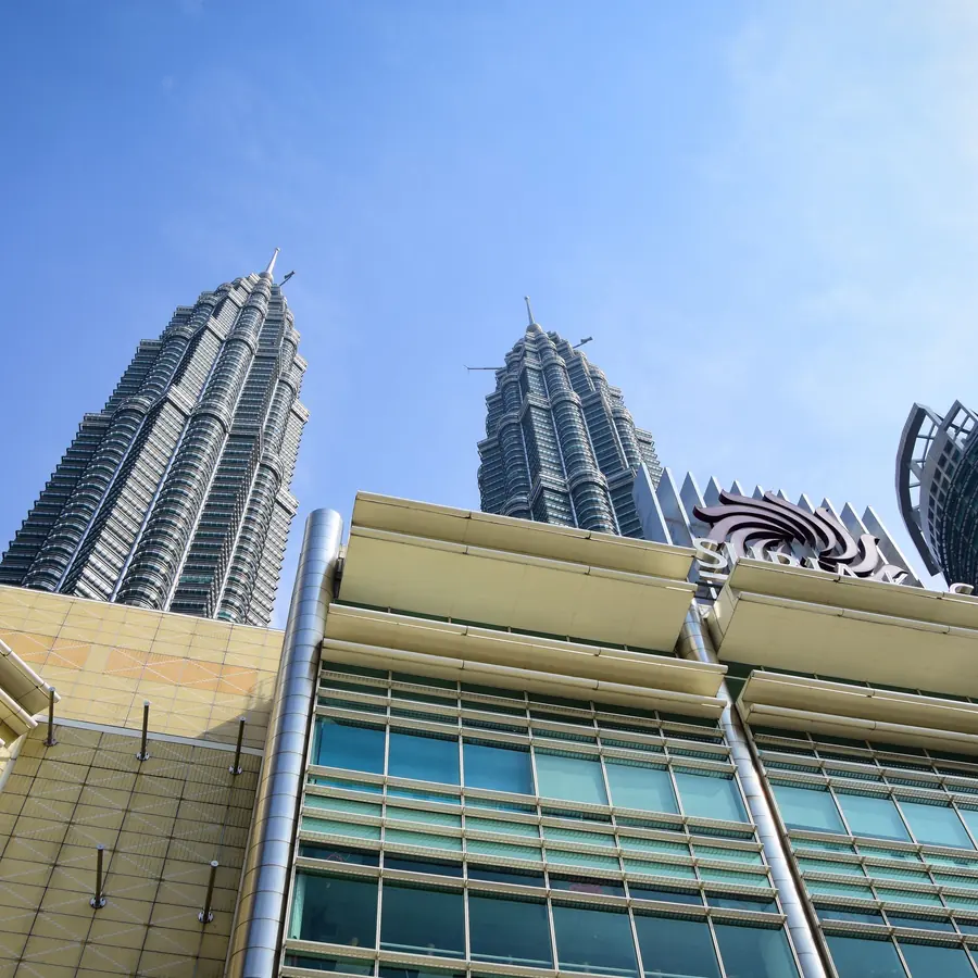 Stunning view of Petronas Towers from the streets of Kuala Lumpur, Malaysia