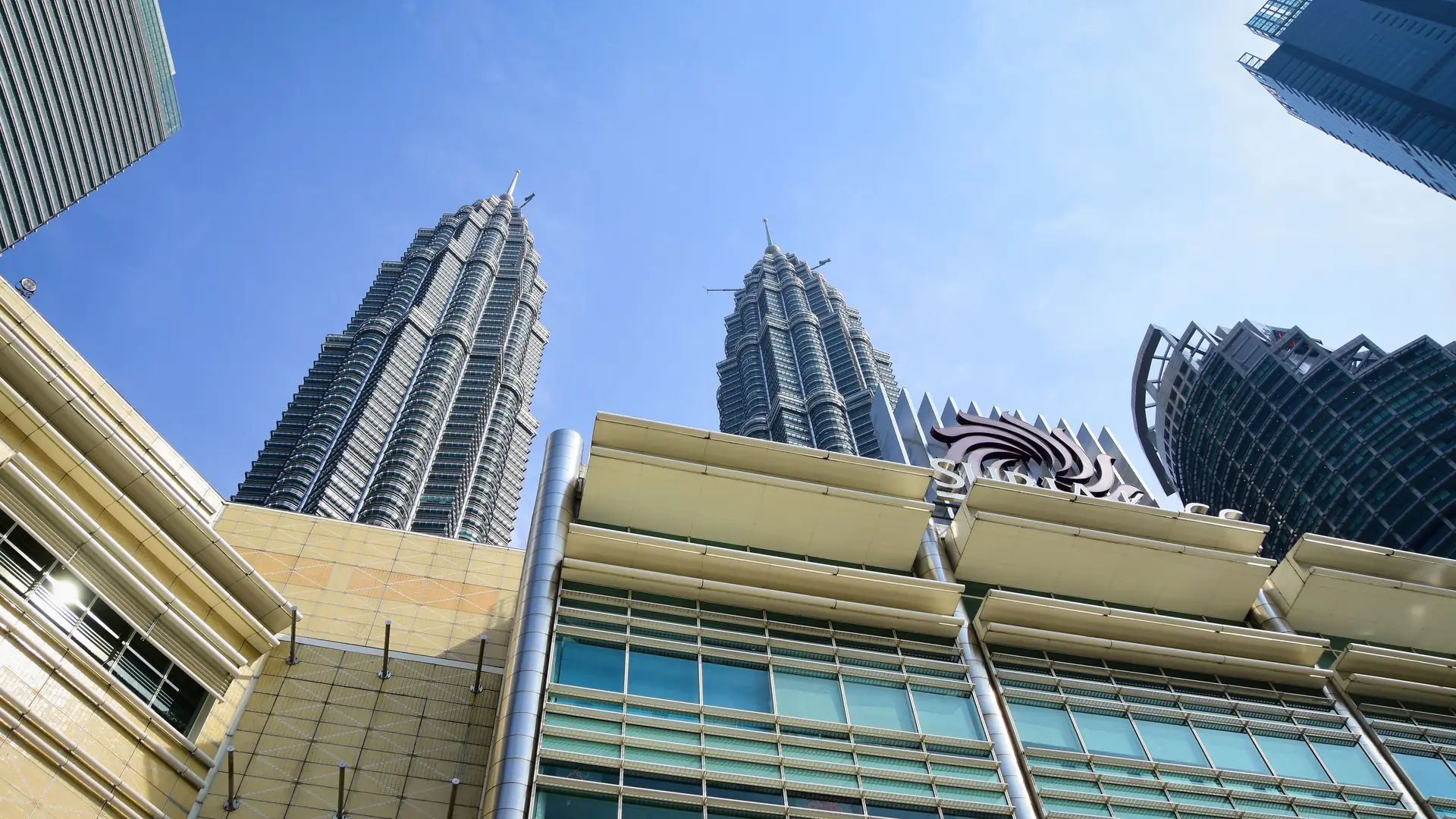 Stunning view of Petronas Towers from the streets of Kuala Lumpur, Malaysia