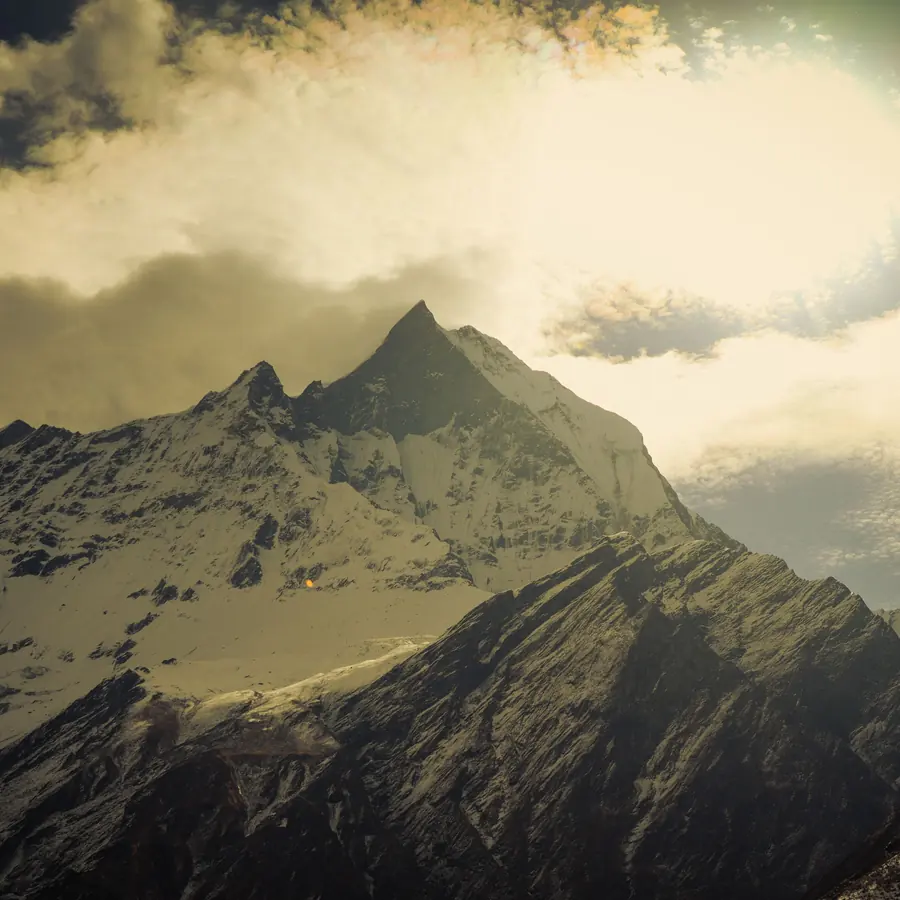 Breathtaking view of Mount Annapurna with dramatic clouds and snow-capped peaks in Nepal
