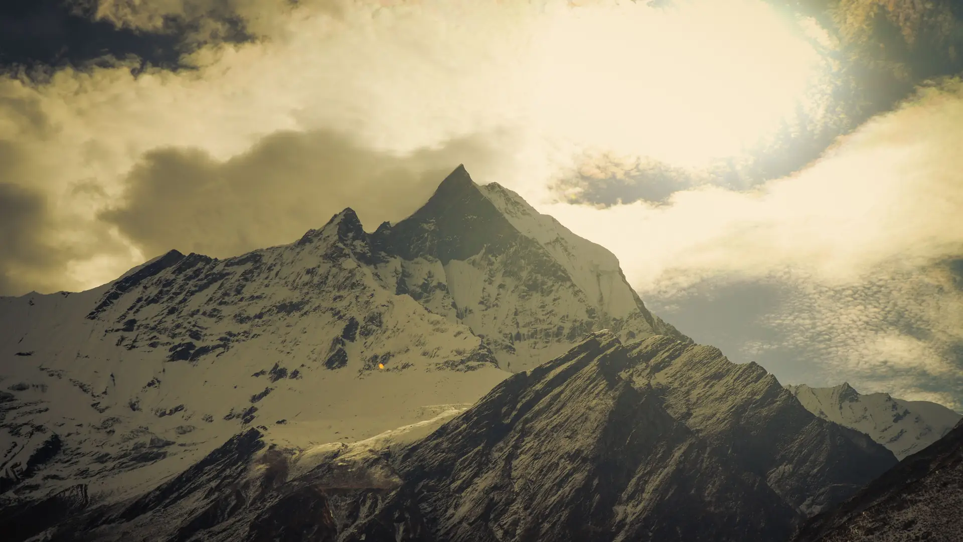 Breathtaking view of Mount Annapurna with dramatic clouds and snow-capped peaks in Nepal