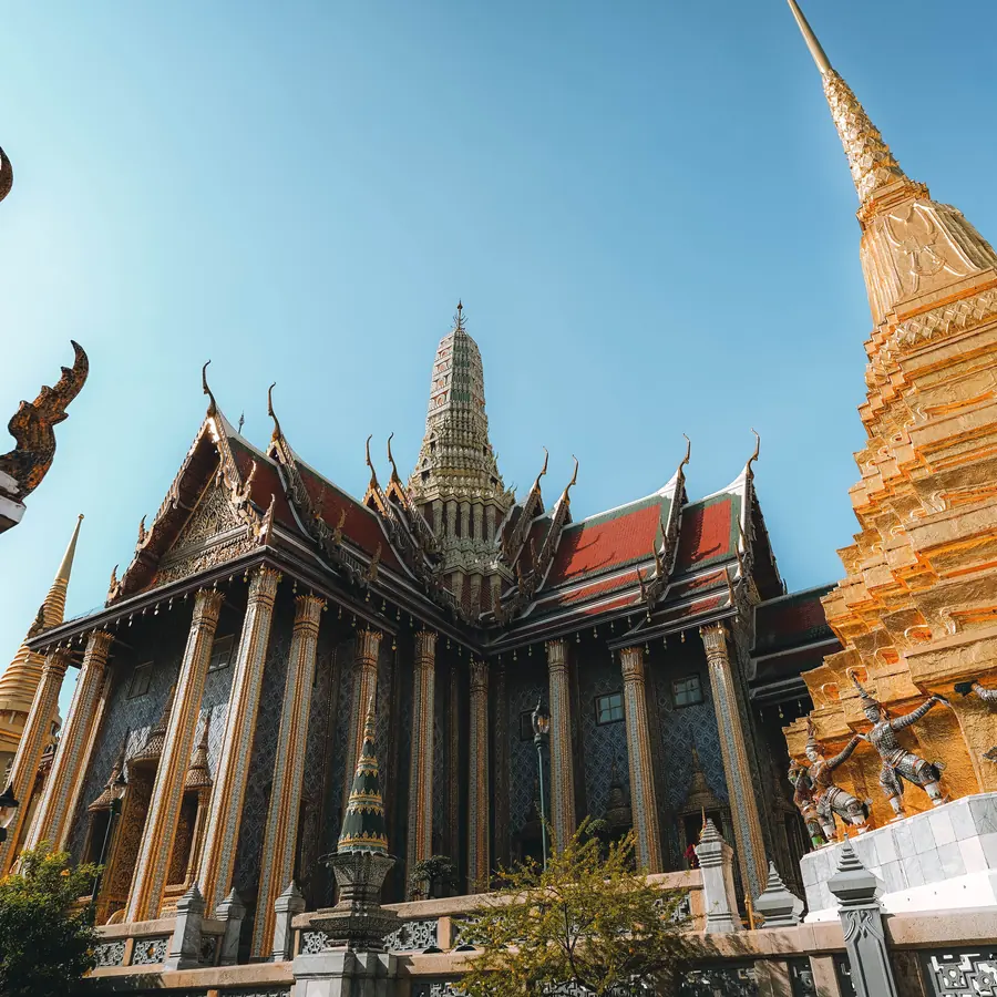 Beautiful capture of Grand Palace temple's intricate architecture and golden pagoda in Bangkok, Thailand