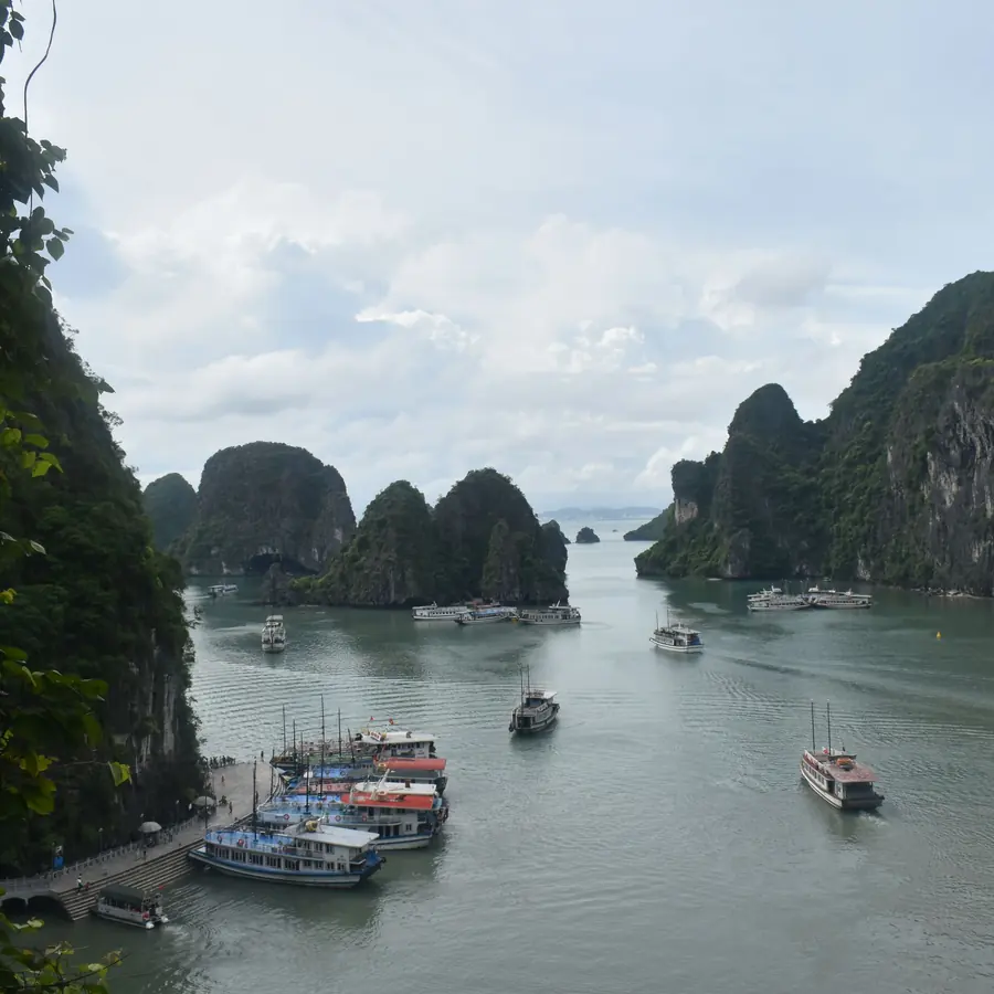 Explore the stunning limestone islands and boats in Ha Long Bay, Vietnam